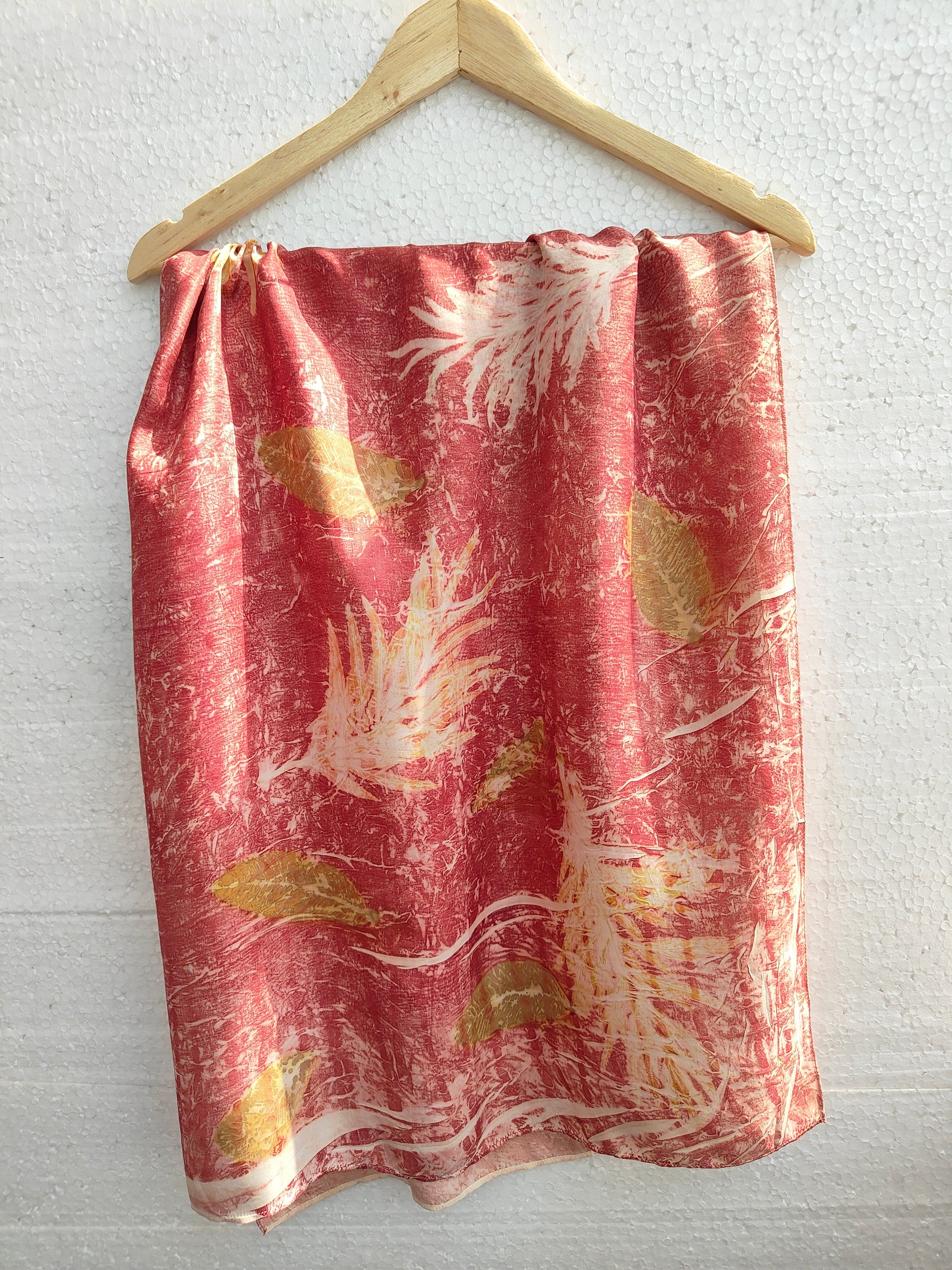 The ecoprinted shrubs and leaves on silk scarf