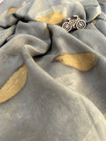 A grey silk fabric with jamun leaf ecoprinted