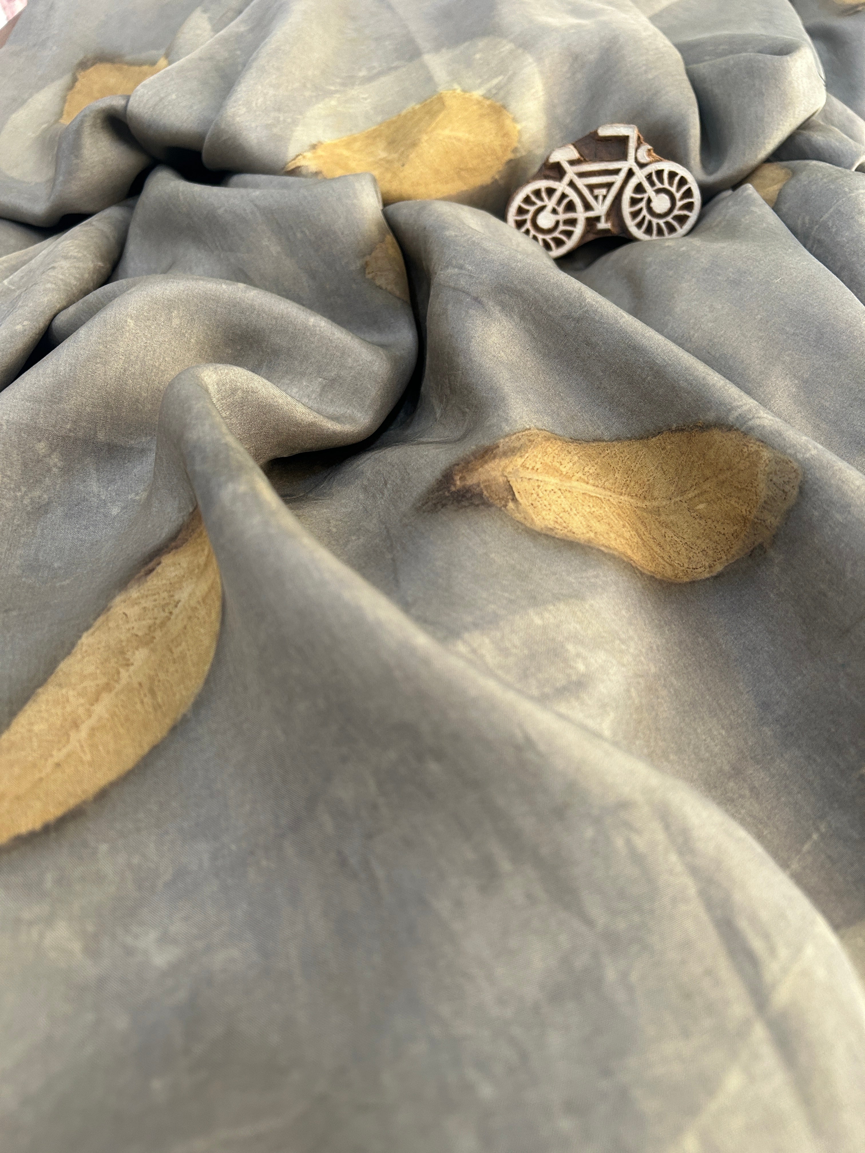 A grey silk fabric with jamun leaf ecoprinted