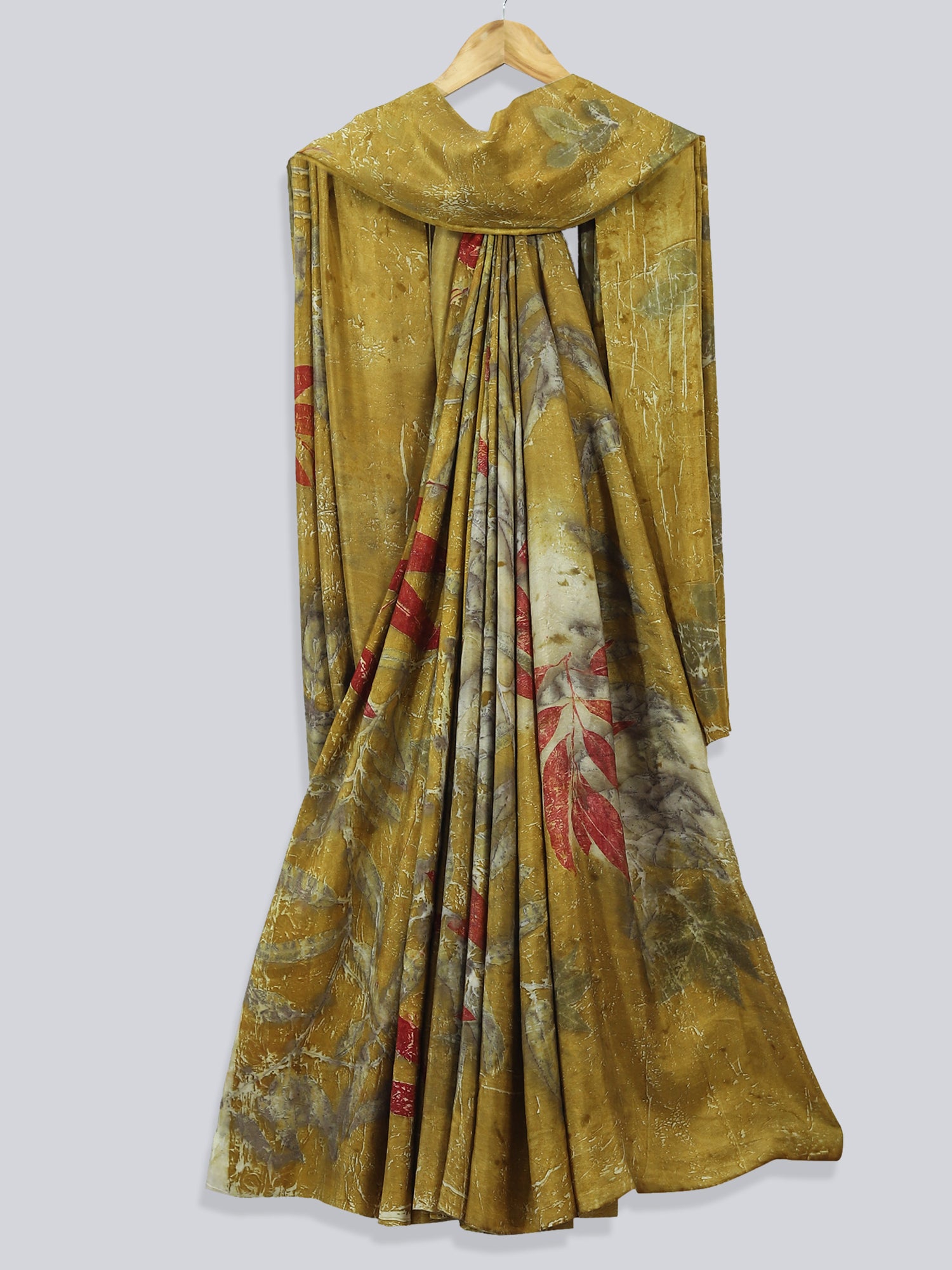 A draped silk saree ecoprinted with eucalyptus leaves.