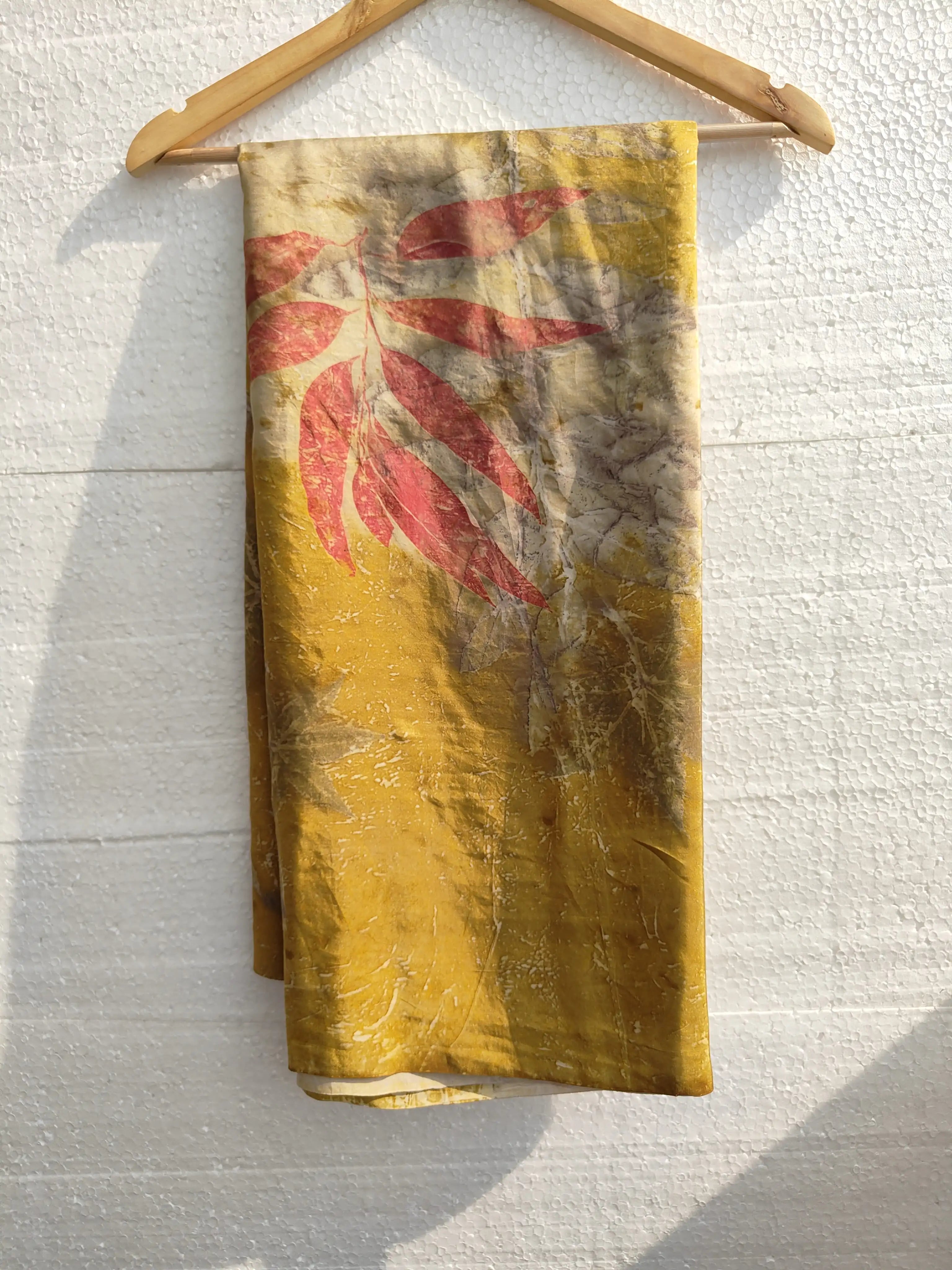 Twilight ecoprinted Pure Silk Saree by kokikar on hanger in sunlight