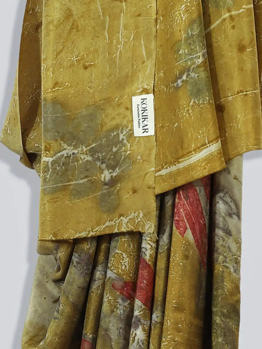 Twilight ecoprinted Pure Silk Saree by kokikar hanging against the wall