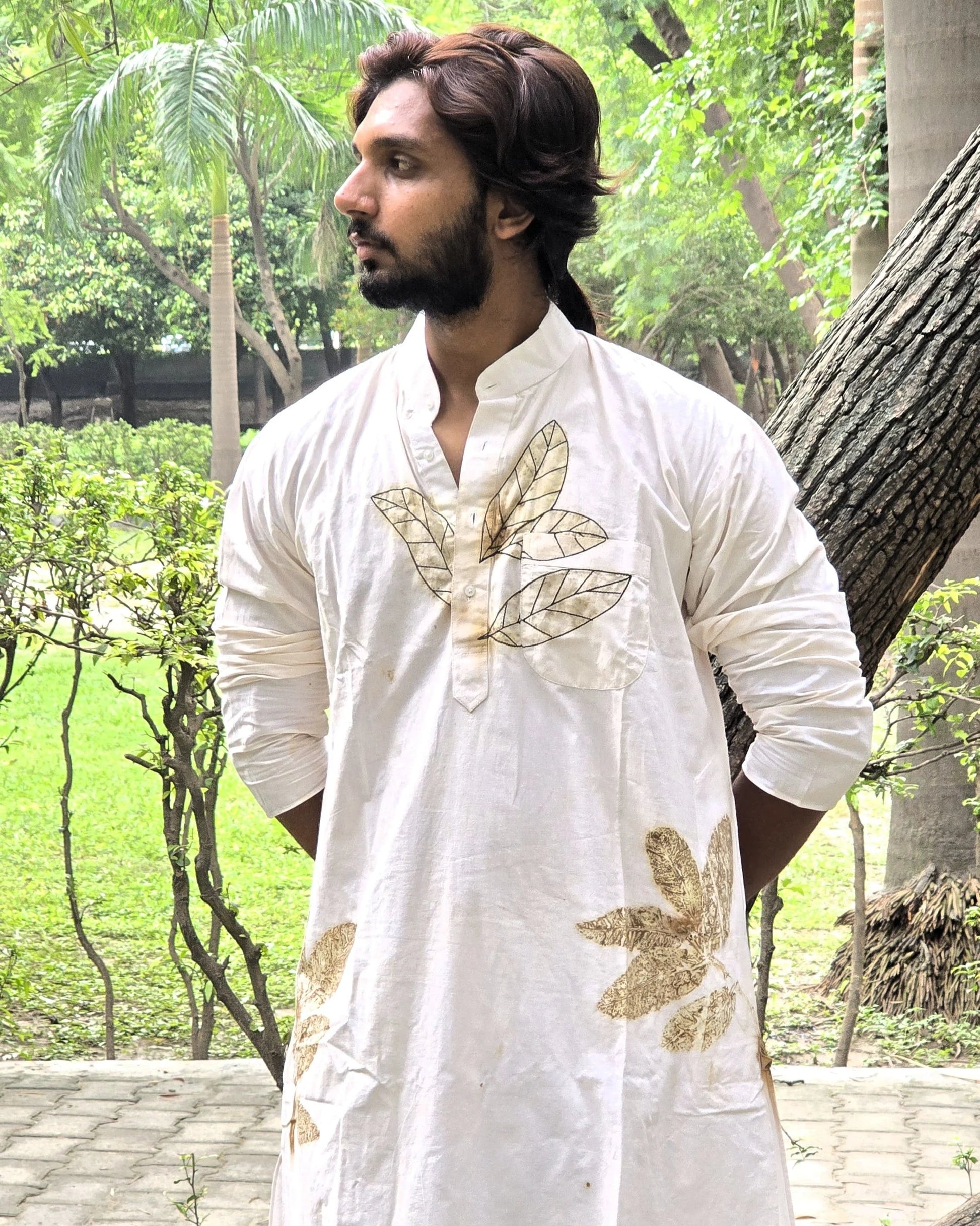 White Floral Threaded Cotton Long Kurta men holding hands behind