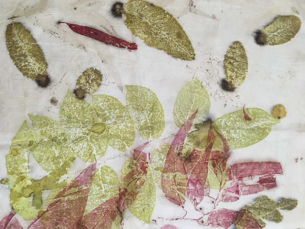 Handmade botanical silk scarf featuring crimson madder leaves and eco-printed foliage on luxurious pure silk.