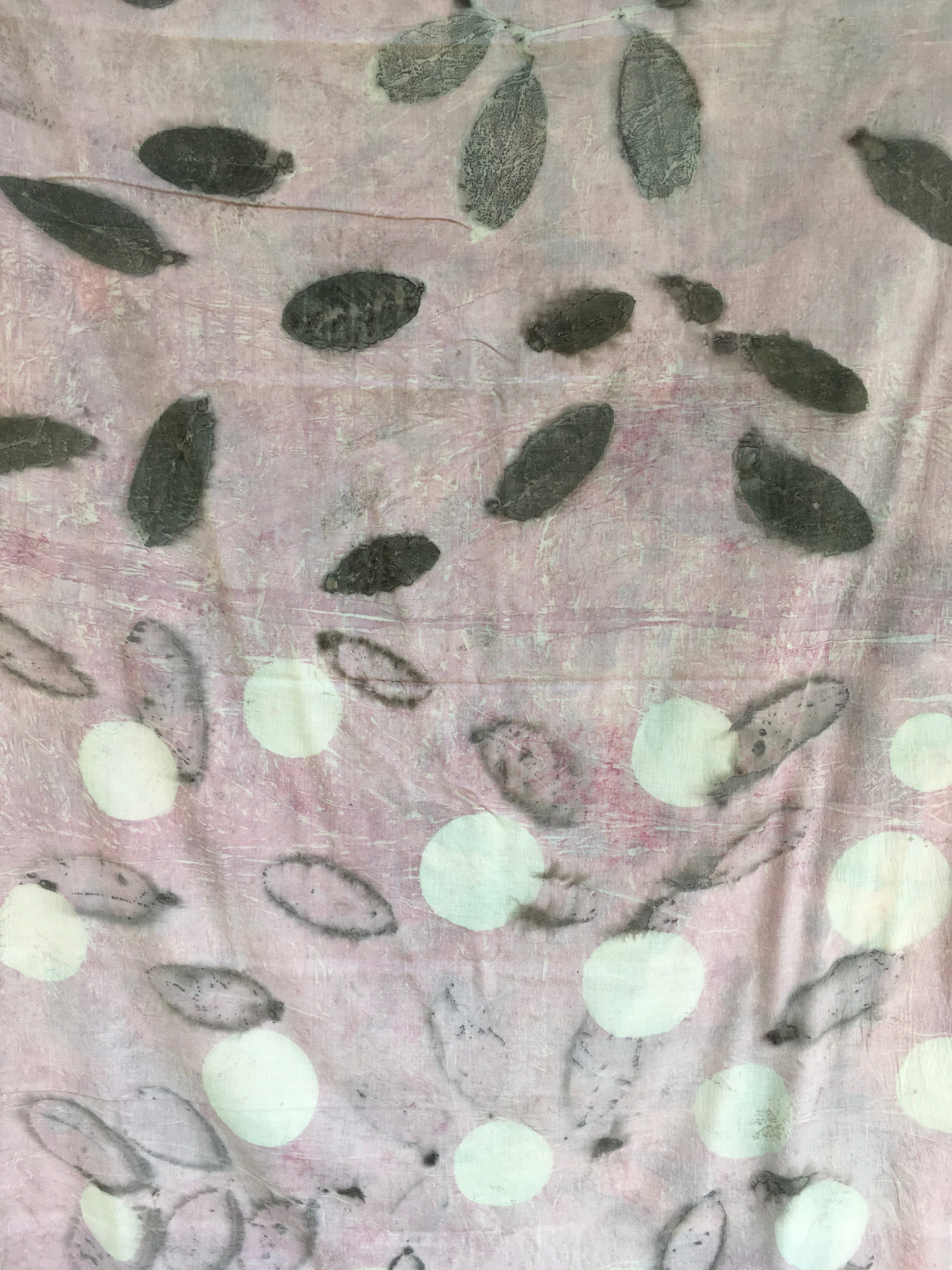 Textured mulmul cotton ecoprinted saree with leaf patterns and white dots on a pink background