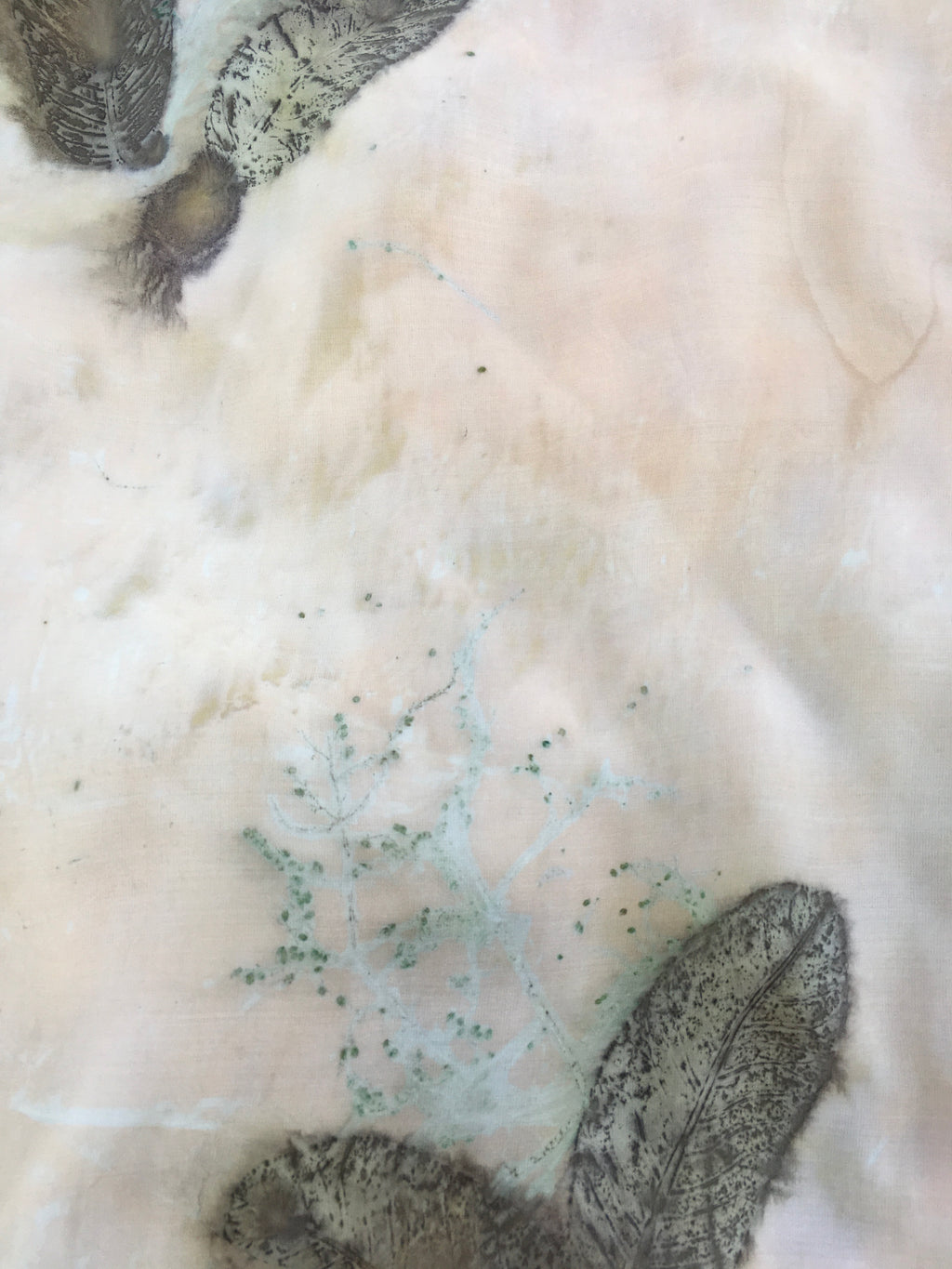Close-up of leaves on a white fabric