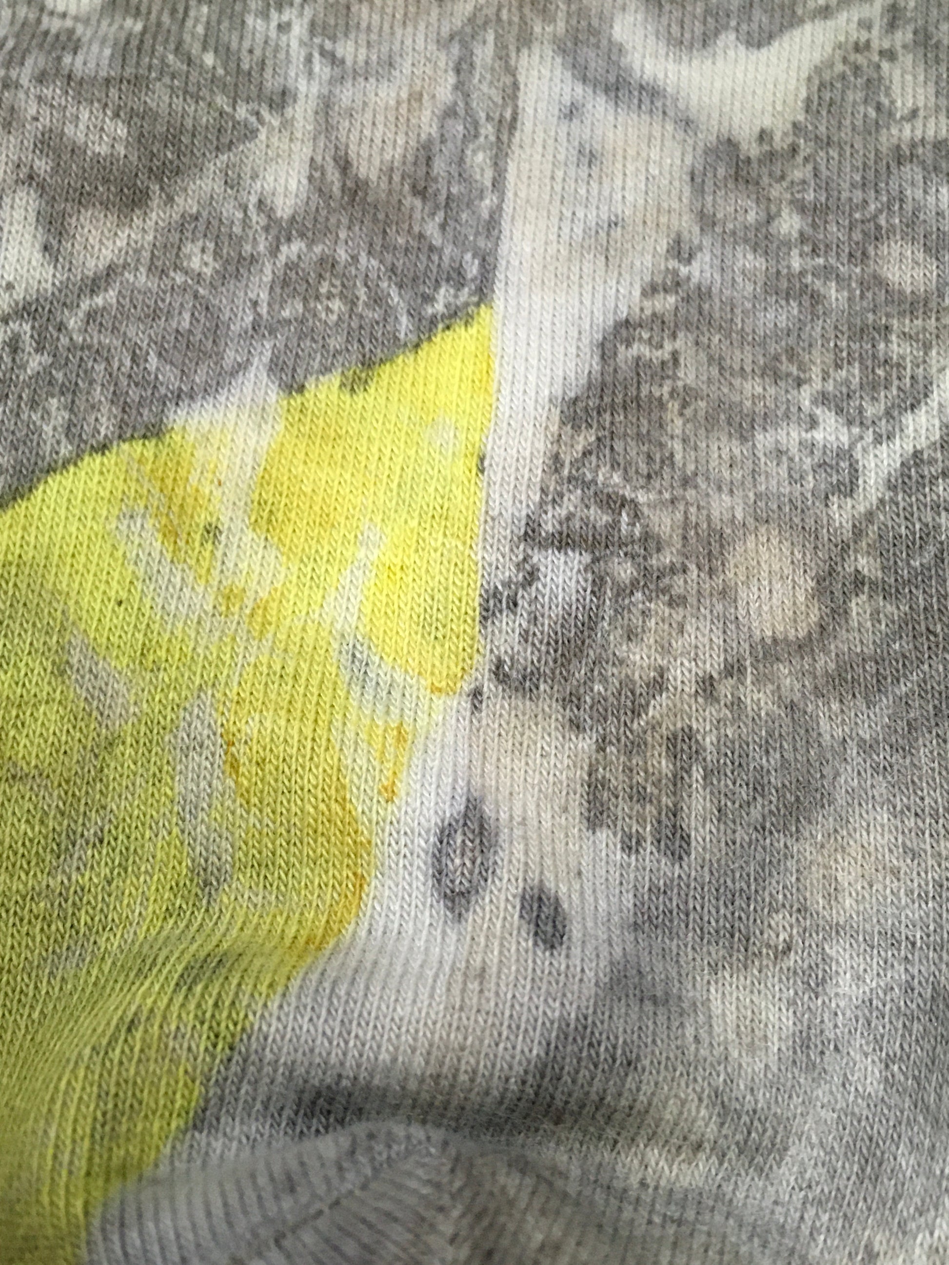 Close-up of a ecoprinted socks with a yellow section