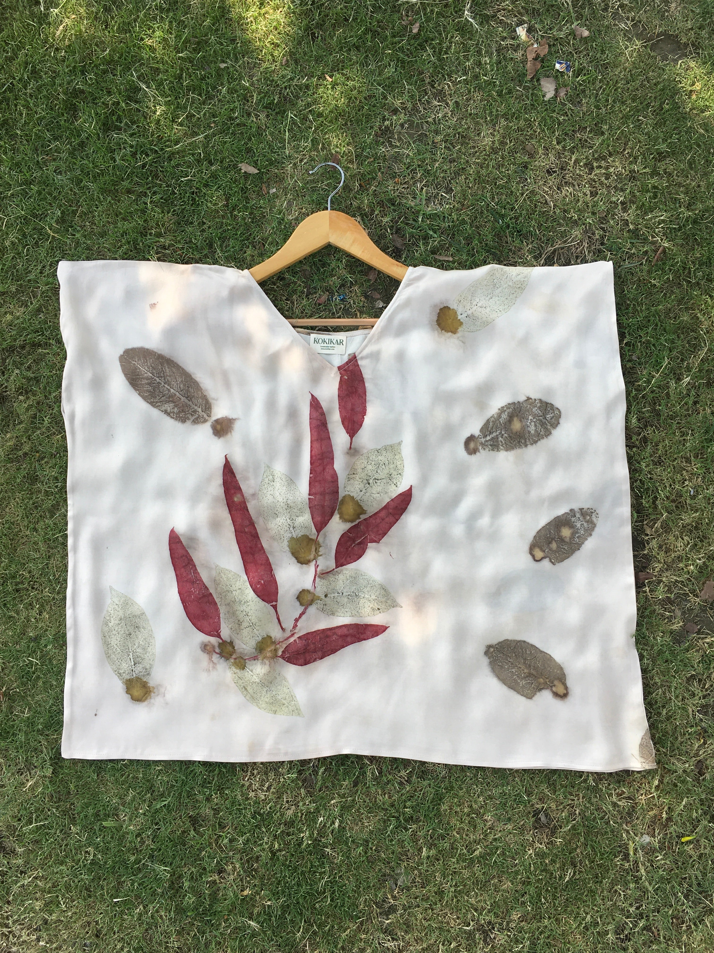 Kaftan Flared Top with leaf patterns on a grassy background