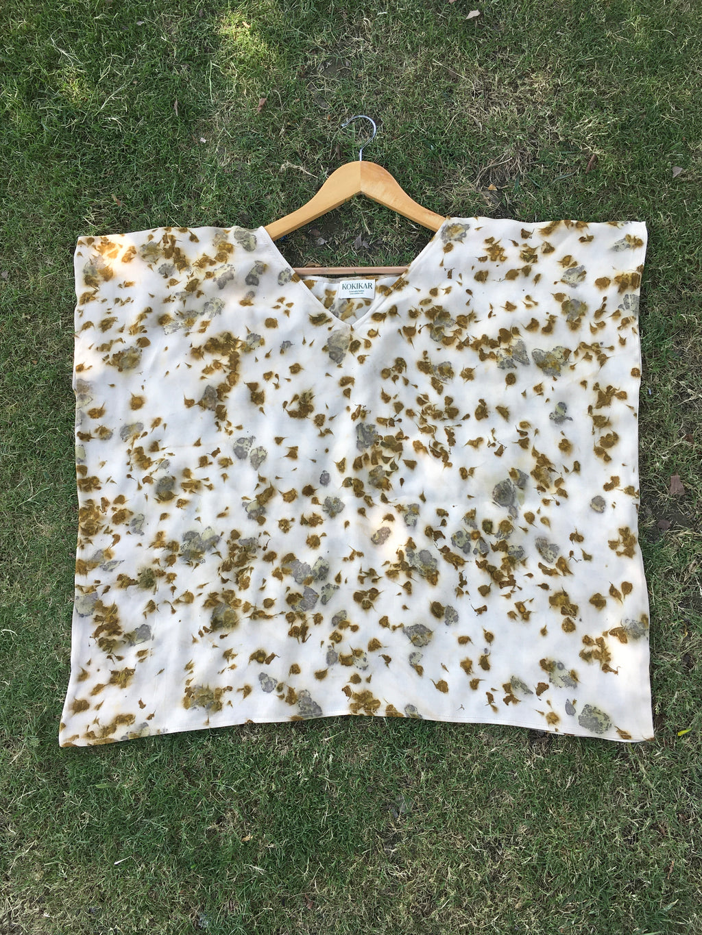 Kaftan Flared Top with marigold and rose petal dye on a grassy background